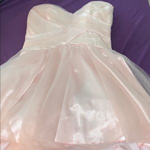 A beautiful light pink strapless puffy dress